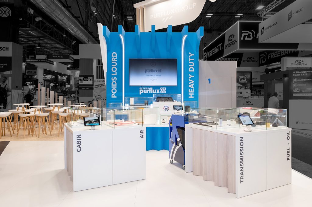 Photo of the custom-made Purflux stand created by R2 Stand at Equipauto, highlighting the product presentation podiums for the heavy goods vehicle range.